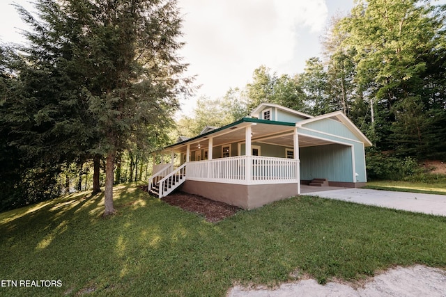 1799 Baker Hwy, Huntsville, TN 37756 - view of front of property with a porch, driveway, a front lawn, and an attached carport