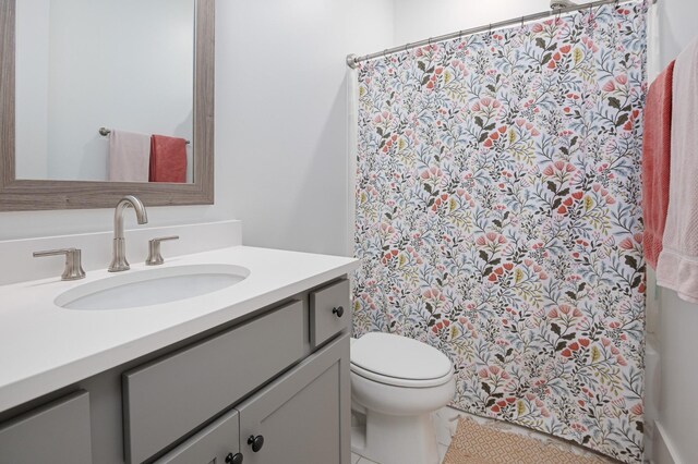 7546 Delancey Dr, College Grove, TN 37046 - bathroom featuring vanity, toilet, and tile patterned flooring
