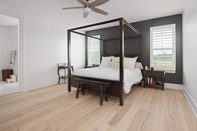 7546 Delancey Dr, College Grove, TN 37046 - bedroom with wood finished floors, baseboards, and a ceiling fan