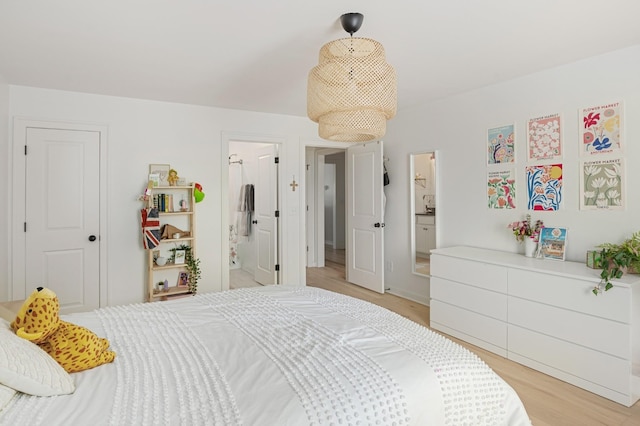 7546 Delancey Dr, College Grove, TN 37046 - bedroom with light wood-type flooring and ensuite bath