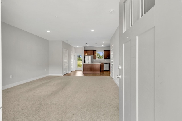 1081 Wells Way, Spring Hill, TN 37174 - unfurnished living room featuring baseboards, recessed lighting, and carpet flooring