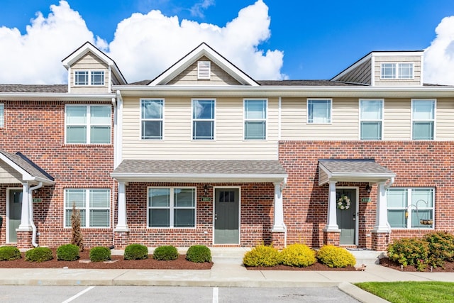 1081 Wells Way, Spring Hill, TN 37174 - townhome / multi-family property with brick siding and roof with shingles