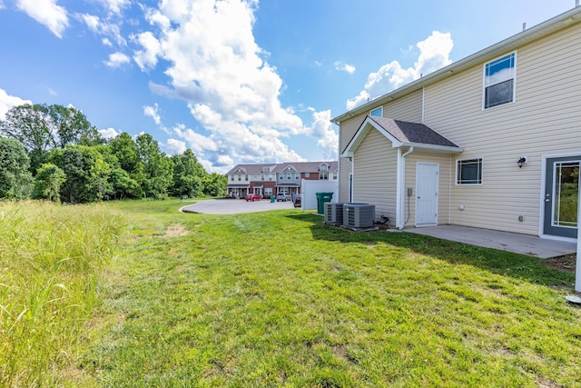 1081 Wells Way, Spring Hill, TN 37174 - view of grassy yard with a patio area and central air condition unit
