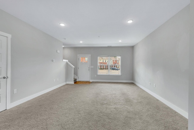 1081 Wells Way, Spring Hill, TN 37174 - unfurnished living room featuring carpet floors, stairs, recessed lighting, and baseboards