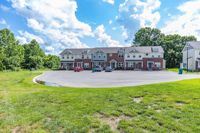 1081 Wells Way, Spring Hill, TN 37174 - back of house with uncovered parking and a lawn