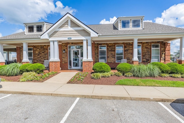 1081 Wells Way, Spring Hill, TN 37174 - view of front of house featuring a porch, uncovered parking, brick siding, and roof with shingles