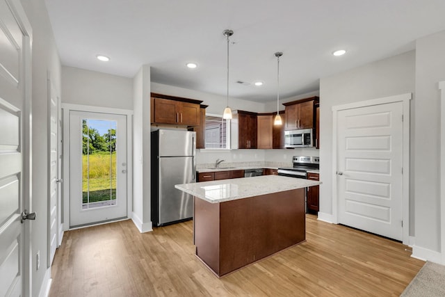 1081 Wells Way, Spring Hill, TN 37174 - kitchen with appliances with stainless steel finishes, light wood-style flooring, hanging light fixtures, baseboards, and recessed lighting