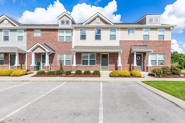 1081 Wells Way, Spring Hill, TN 37174 - townhome / multi-family property featuring brick siding and uncovered parking