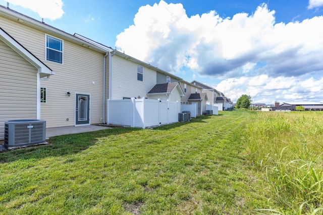 1081 Wells Way, Spring Hill, TN 37174 - rear view of house featuring central AC unit and a patio