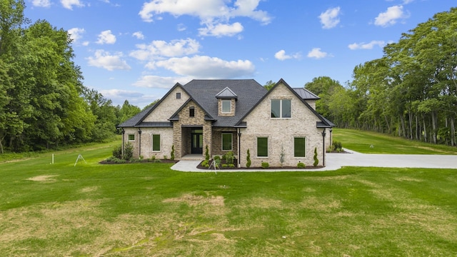 724 Bradshaw Rd, Lebanon, TN 37087 - view of front facade featuring a front yard, brick siding, and stone siding