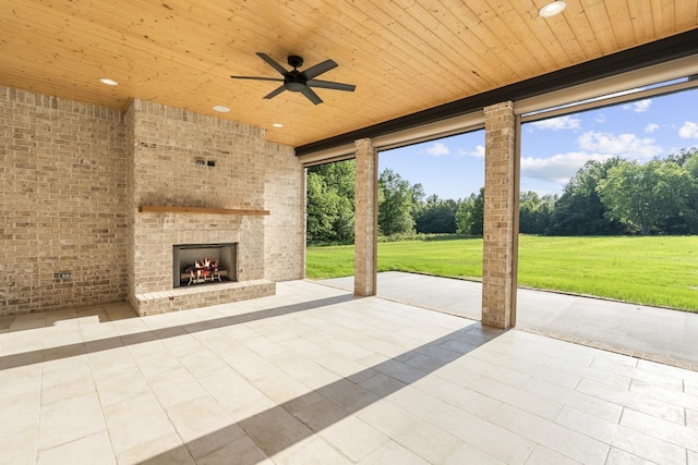 724 Bradshaw Rd, Lebanon, TN 37087 - view of patio / terrace with an outdoor brick fireplace, a ceiling fan, and view of scattered trees