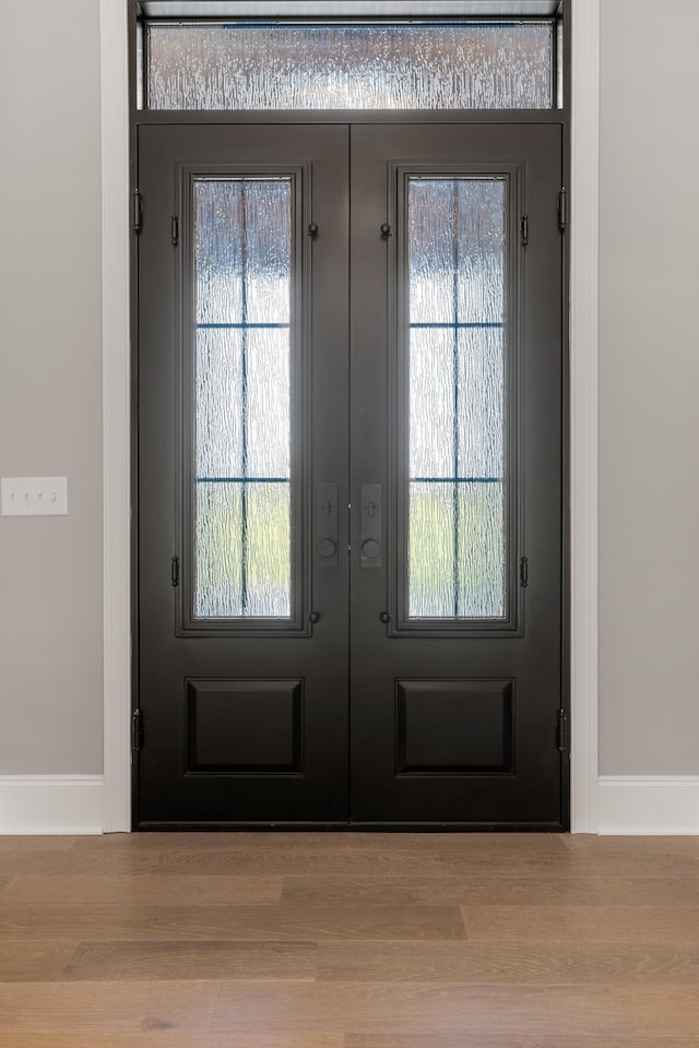 724 Bradshaw Rd, Lebanon, TN 37087 - entryway featuring french doors, baseboards, wood finished floors, and plenty of natural light