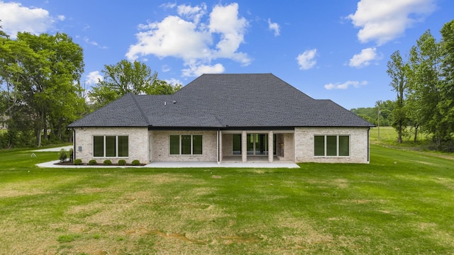 724 Bradshaw Rd, Lebanon, TN 37087 - rear view of house featuring a patio, a lawn, and roof with shingles