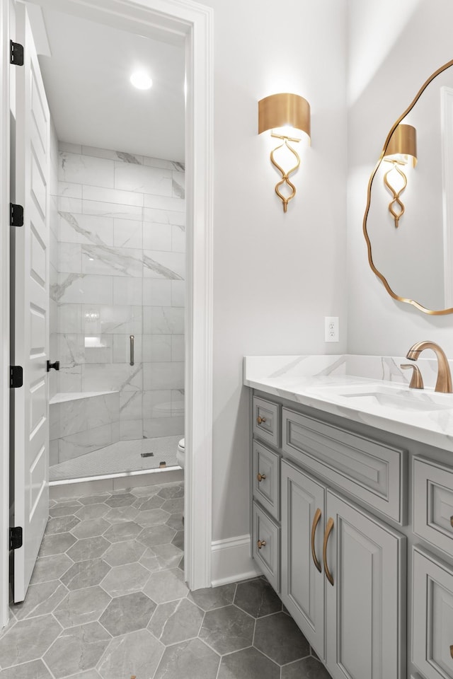 724 Bradshaw Rd, Lebanon, TN 37087 - full bathroom featuring vanity, a marble finish shower, toilet, baseboards, and recessed lighting
