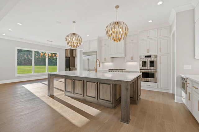 724 Bradshaw Rd, Lebanon, TN 37087 - kitchen with a chandelier, built in appliances, a sink, light countertops, and recessed lighting