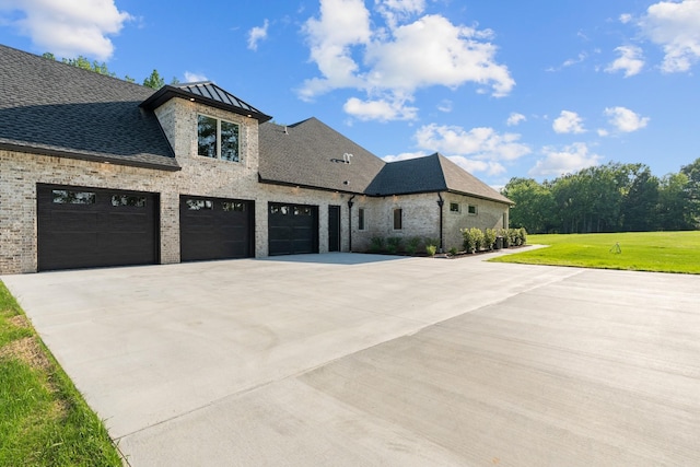 724 Bradshaw Rd, Lebanon, TN 37087 - view of front of house featuring concrete driveway, brick siding, a garage, a front lawn, and roof with shingles
