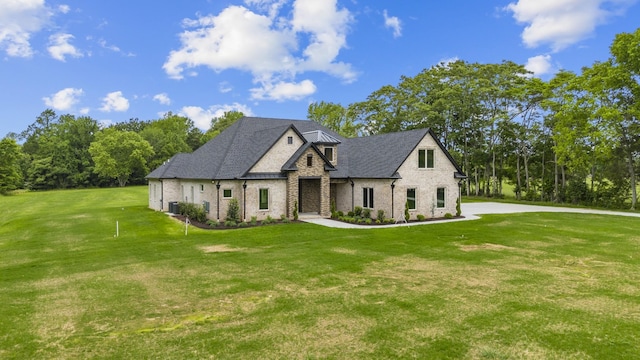 724 Bradshaw Rd, Lebanon, TN 37087 - french provincial home with brick siding, a front yard, central air condition unit, and roof with shingles