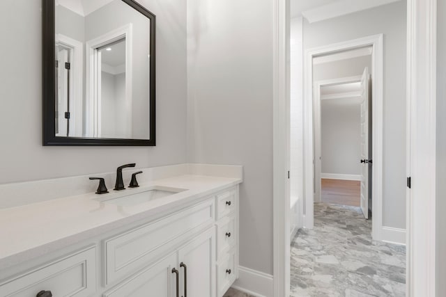 724 Bradshaw Rd, Lebanon, TN 37087 - bathroom featuring vanity, baseboards, marble finish flooring, and a tub to relax in