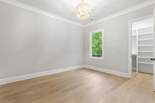 724 Bradshaw Rd, Lebanon, TN 37087 - unfurnished room featuring a chandelier, light wood-style flooring, ornamental molding, and baseboards