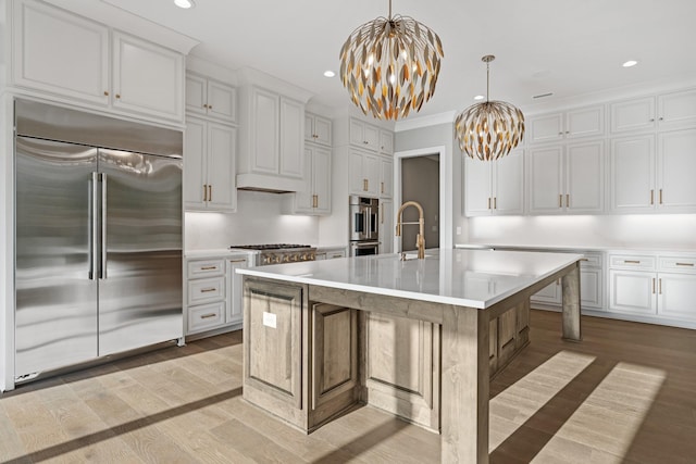 724 Bradshaw Rd, Lebanon, TN 37087 - kitchen featuring stainless steel appliances, a chandelier, light countertops, white cabinetry, and recessed lighting