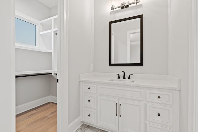 724 Bradshaw Rd, Lebanon, TN 37087 - bathroom featuring vanity, baseboards, and wood finished floors