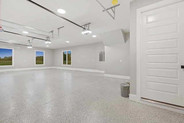 724 Bradshaw Rd, Lebanon, TN 37087 - garage featuring a garage door opener, electric panel, baseboards, and recessed lighting