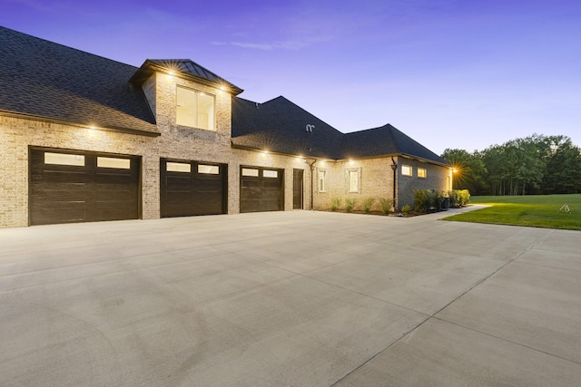 724 Bradshaw Rd, Lebanon, TN 37087 - view of front facade with concrete driveway, a yard, an attached garage, brick siding, and a shingled roof
