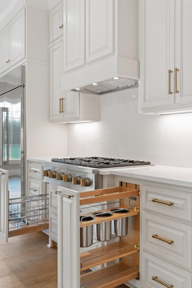 724 Bradshaw Rd, Lebanon, TN 37087 - kitchen with stainless steel appliances, white cabinetry, light countertops, and light wood-style flooring