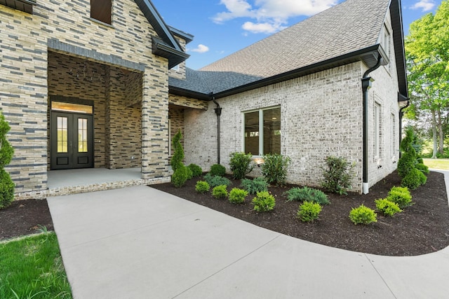 724 Bradshaw Rd, Lebanon, TN 37087 - property entrance featuring french doors, a shingled roof, and brick siding