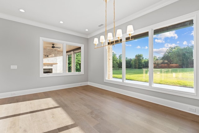 724 Bradshaw Rd, Lebanon, TN 37087 - unfurnished dining area featuring baseboards, crown molding, wood finished floors, a ceiling fan, and a chandelier