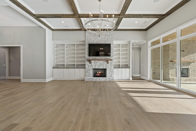 724 Bradshaw Rd, Lebanon, TN 37087 - unfurnished living room featuring a fireplace, baseboards, a chandelier, wood finished floors, and coffered ceiling