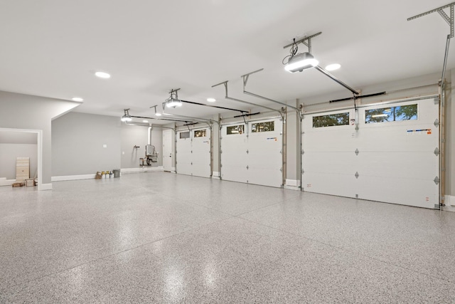 724 Bradshaw Rd, Lebanon, TN 37087 - garage featuring a garage door opener and baseboards