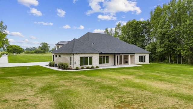 724 Bradshaw Rd, Lebanon, TN 37087 - back of house with a patio and a lawn