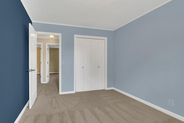 4132 Philhall Pkwy, Antioch, TN 37013 - unfurnished bedroom with baseboards, carpet flooring, ornamental molding, and a closet