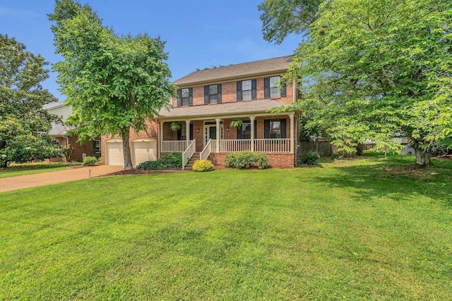 4132 Philhall Pkwy, Antioch, TN 37013 - colonial-style house with a porch, driveway, and brick siding