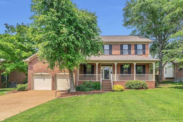 4132 Philhall Pkwy, Antioch, TN 37013 - view of front of property with concrete driveway, brick siding, a front lawn, a porch, and central AC unit