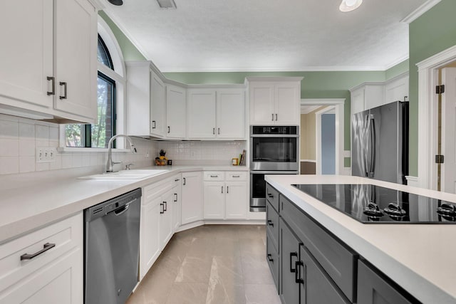 4132 Philhall Pkwy, Antioch, TN 37013 - kitchen with stainless steel appliances, a sink, light countertops, gray cabinets, and decorative backsplash