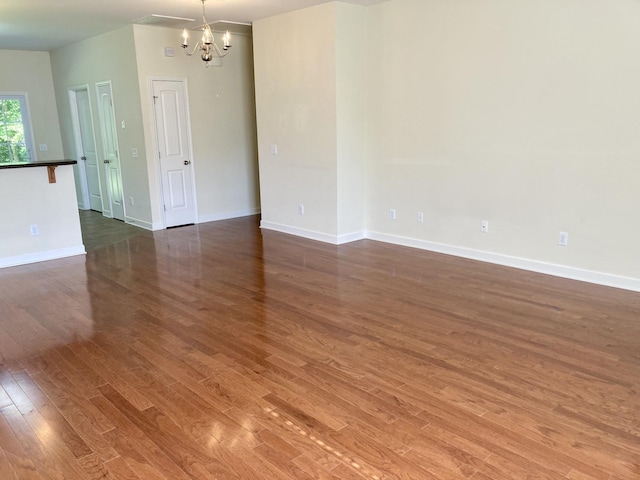 507 Whirlaway Ct, Burns, TN 37029 - unfurnished room with a chandelier and wood finished floors