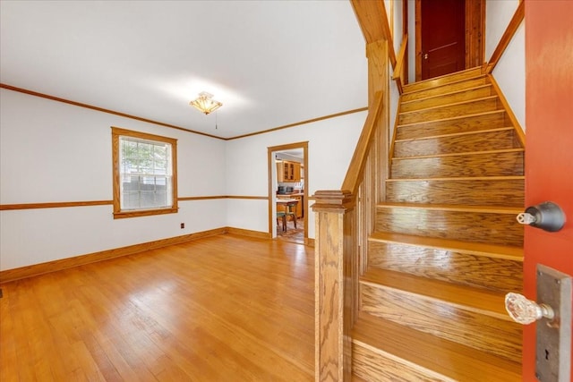 256 Tanksley Ave, Nashville, TN 37211 - staircase featuring wood finished floors, crown molding, and baseboards