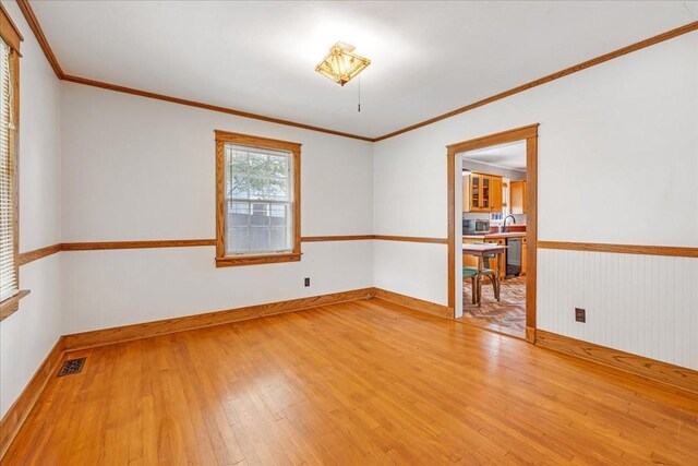 256 Tanksley Ave, Nashville, TN 37211 - unfurnished room featuring light wood finished floors, ornamental molding, baseboards, and a sink