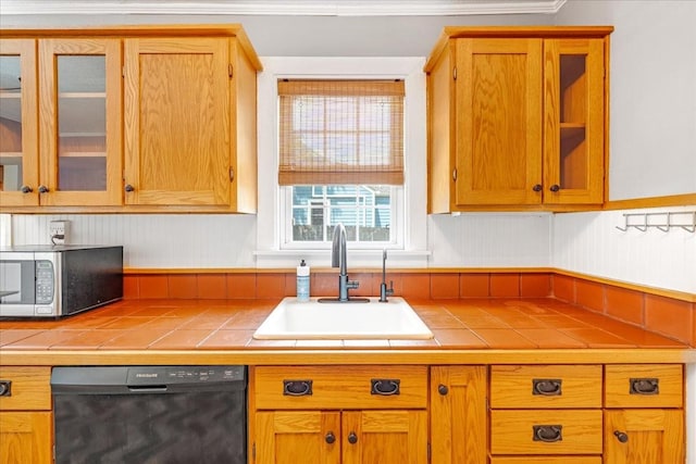 256 Tanksley Ave, Nashville, TN 37211 - kitchen featuring stainless steel microwave, dishwasher, a sink, tile counters, and glass insert cabinets