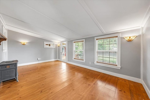 256 Tanksley Ave, Nashville, TN 37211 - unfurnished living room with hardwood / wood-style flooring, lofted ceiling, and baseboards