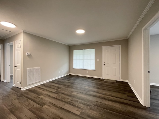 1004 E Railroad St, Waverly, TN 37185 - foyer entrance with ornamental molding, dark wood-style floors, and baseboards