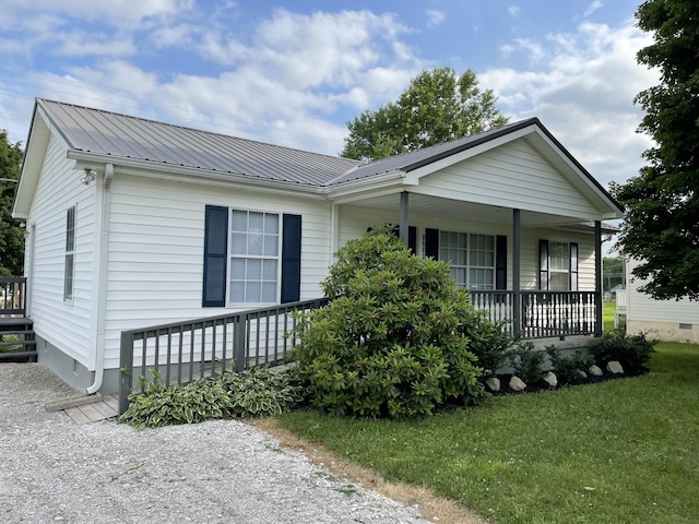 1004 E Railroad St, Waverly, TN 37185 - view of front of property featuring a porch, metal roof, a front yard, and crawl space