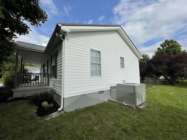 1004 E Railroad St, Waverly, TN 37185 - view of home's exterior featuring a yard, central AC, crawl space, and covered porch