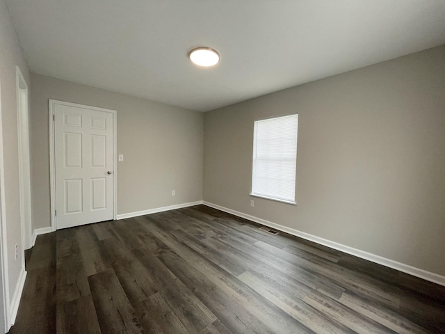 1004 E Railroad St, Waverly, TN 37185 - spare room with dark wood finished floors and baseboards