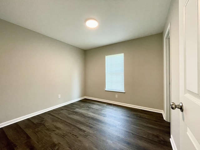 1004 E Railroad St, Waverly, TN 37185 - spare room with dark wood-style flooring and baseboards