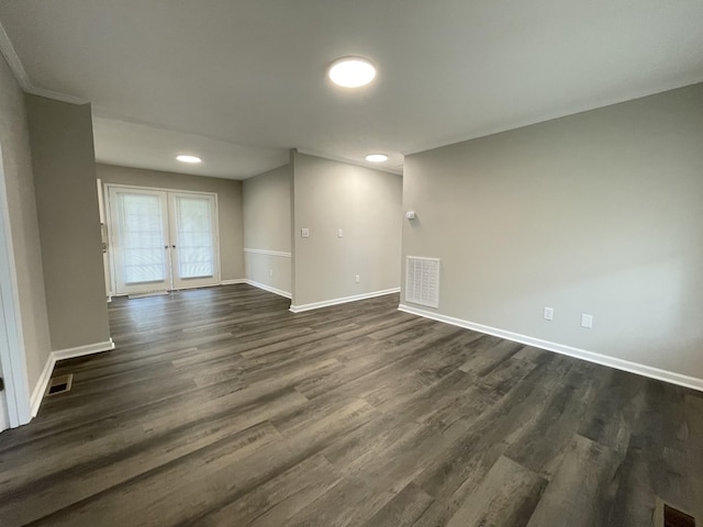 1004 E Railroad St, Waverly, TN 37185 - spare room featuring baseboards, dark wood finished floors, recessed lighting, and french doors