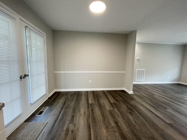 1004 E Railroad St, Waverly, TN 37185 - spare room featuring dark wood-style flooring and baseboards