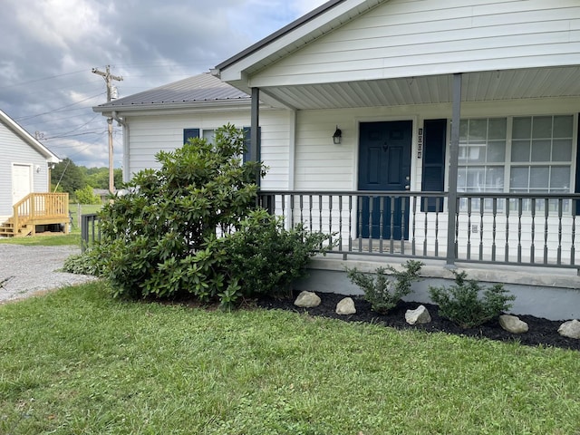 1004 E Railroad St, Waverly, TN 37185 - property entrance with a lawn, covered porch, and metal roof